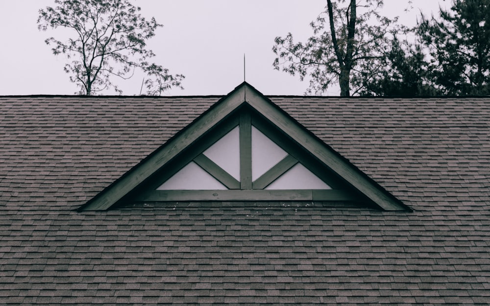 A new architectural asphalt shingle roof with a gabled dormer.
